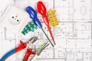 Electrician blueprints and equipment for job in Centennial, CO